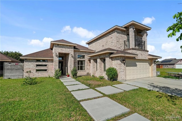 view of front of home with a front yard and a garage