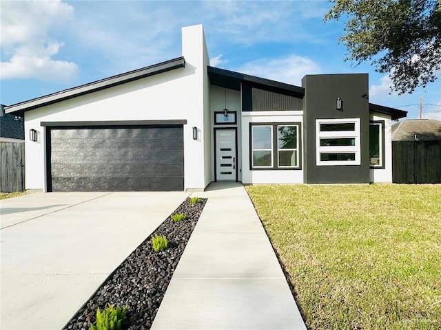 contemporary house with a garage and a front lawn