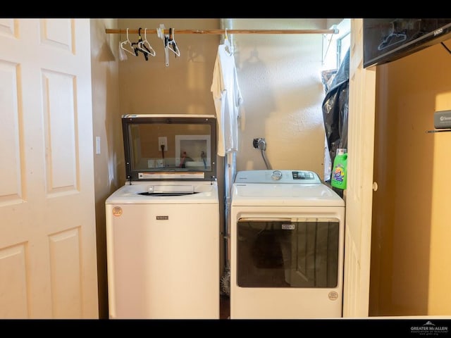 laundry room featuring separate washer and dryer