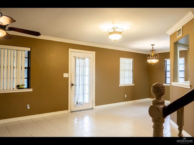 entrance foyer with ceiling fan and crown molding