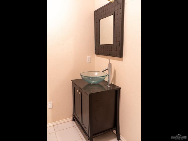 bathroom featuring tile patterned flooring and vanity