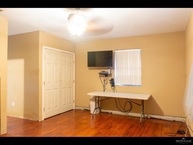 interior space with hardwood / wood-style flooring, a closet, and ceiling fan