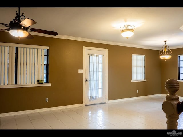 entryway with ceiling fan, a healthy amount of sunlight, and ornamental molding