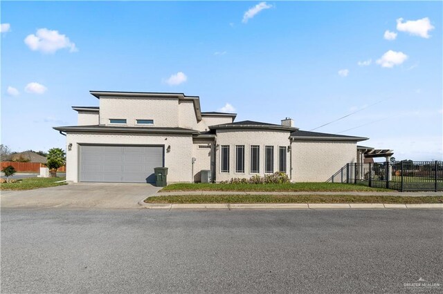 705 W Vinson Ave, Harlingen, TX 78550 - prairie-style home featuring cooling unit and a garage