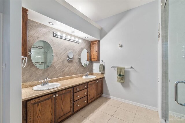 705 W Vinson Ave, Harlingen, TX 78550 - bathroom with tile patterned flooring, vanity, and an enclosed shower
