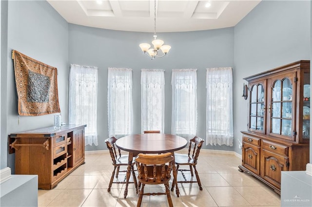 705 W Vinson Ave, Harlingen, TX 78550 - dining space featuring a wealth of natural light, coffered ceiling, light tile patterned floors, and a notable chandelier
