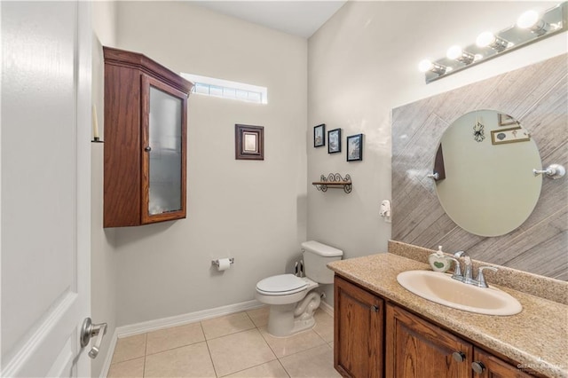 705 W Vinson Ave, Harlingen, TX 78550 - bathroom with tile patterned flooring, vanity, and toilet