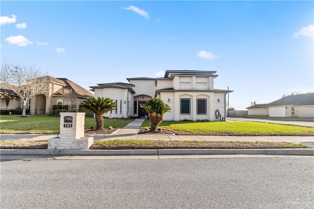 view of front of property with a front lawn