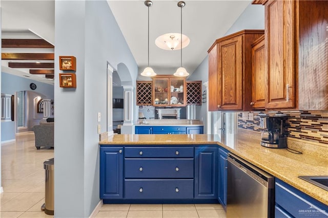 705 W Vinson Ave, Harlingen, TX 78550 - kitchen with dishwasher, light tile patterned floors, backsplash, and decorative light fixtures