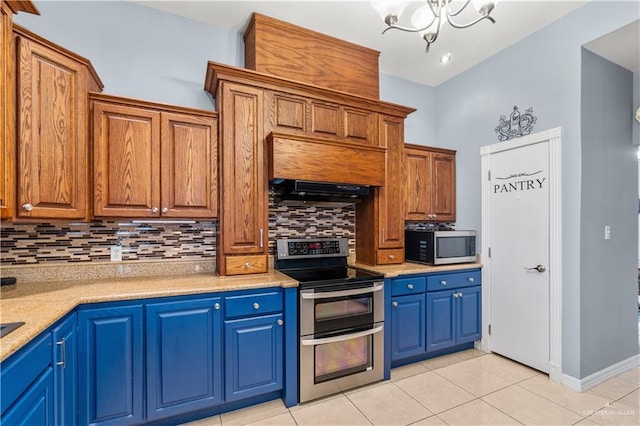 705 W Vinson Ave, Harlingen, TX 78550 - kitchen featuring range hood, tasteful backsplash, light tile patterned floors, a notable chandelier, and stainless steel appliances