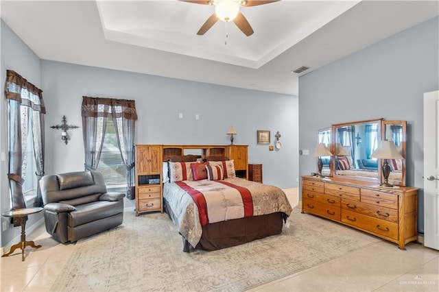 705 W Vinson Ave, Harlingen, TX 78550 - bedroom featuring light tile patterned floors, a tray ceiling, and ceiling fan