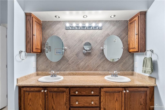 705 W Vinson Ave, Harlingen, TX 78550 - bathroom featuring tasteful backsplash and vanity