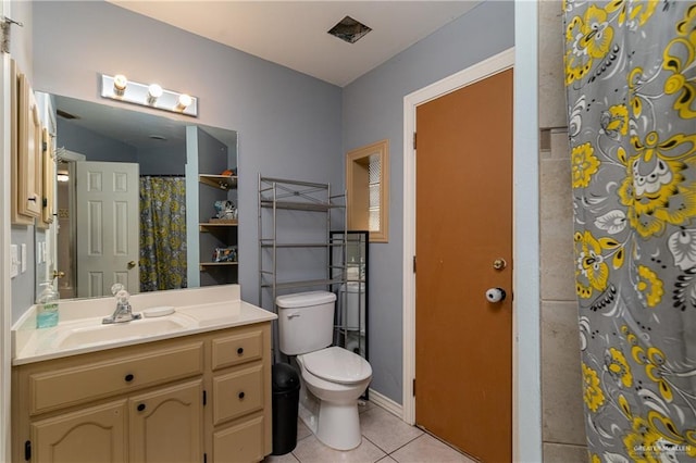 bathroom featuring tile patterned flooring, vanity, a shower with curtain, and toilet