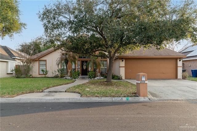 view of front of house with a garage and a front lawn