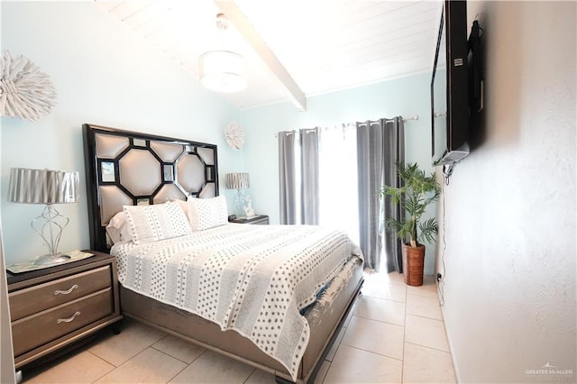 6608 Padre Blvd, South Padre Island, TX 78597 - bedroom featuring light tile patterned floors and beamed ceiling