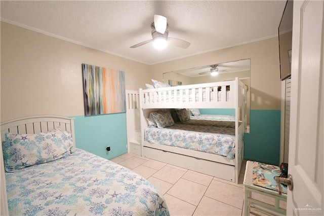 6608 Padre Blvd, South Padre Island, TX 78597 - bedroom featuring ornamental molding, light tile patterned floors, a textured ceiling, and ceiling fan
