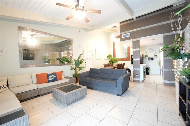 6608 Padre Blvd, South Padre Island, TX 78597 - living area featuring ceiling fan, light tile patterned flooring, and beamed ceiling