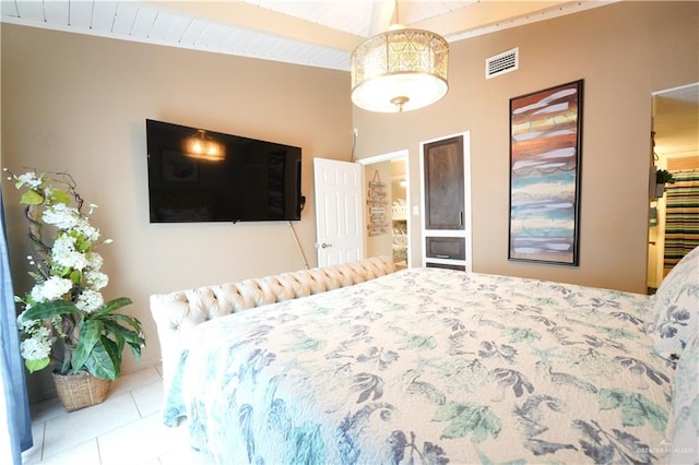 6608 Padre Blvd, South Padre Island, TX 78597 - tiled bedroom featuring beamed ceiling and high vaulted ceiling