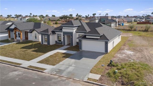 view of front of home with a garage and a front yard