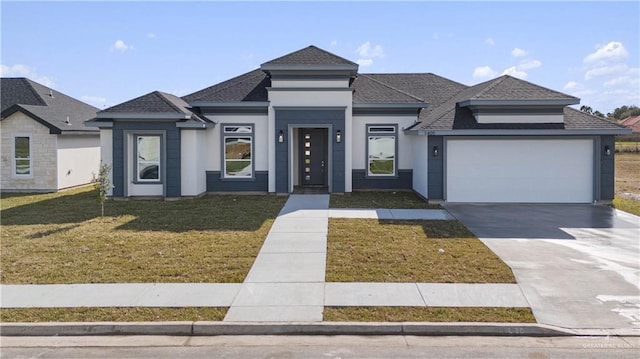 prairie-style house with a front lawn and a garage