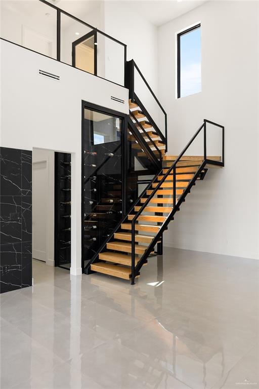 1620 S Ongar Ln, Edinburg, TX 78539 - stairway with a towering ceiling