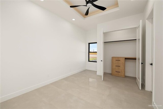 1620 S Ongar Ln, Edinburg, TX 78539 - unfurnished bedroom featuring a raised ceiling, recessed lighting, baseboards, a closet, and ceiling fan