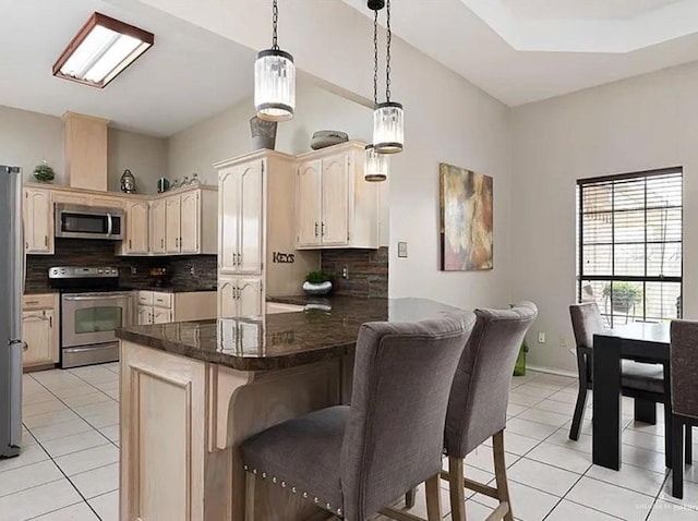 1806 E Flora Ave, Hidalgo, TX 78557 - kitchen with appliances with stainless steel finishes, light tile patterned floors, and tasteful backsplash