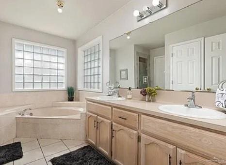 1806 E Flora Ave, Hidalgo, TX 78557 - full bathroom featuring tile patterned floors, double vanity, and a garden tub