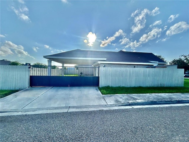 1806 E Flora Ave, Hidalgo, TX 78557 - view of home's exterior featuring a fenced front yard and a gate
