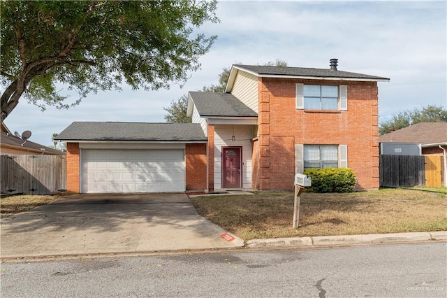 view of property featuring a front lawn and a garage