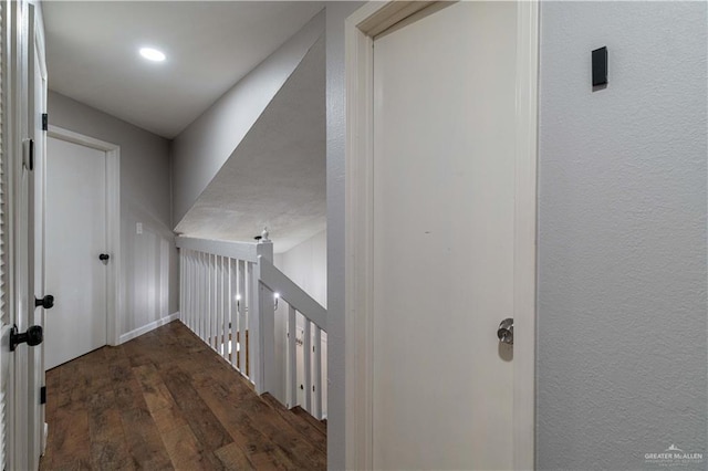 hall with dark hardwood / wood-style flooring