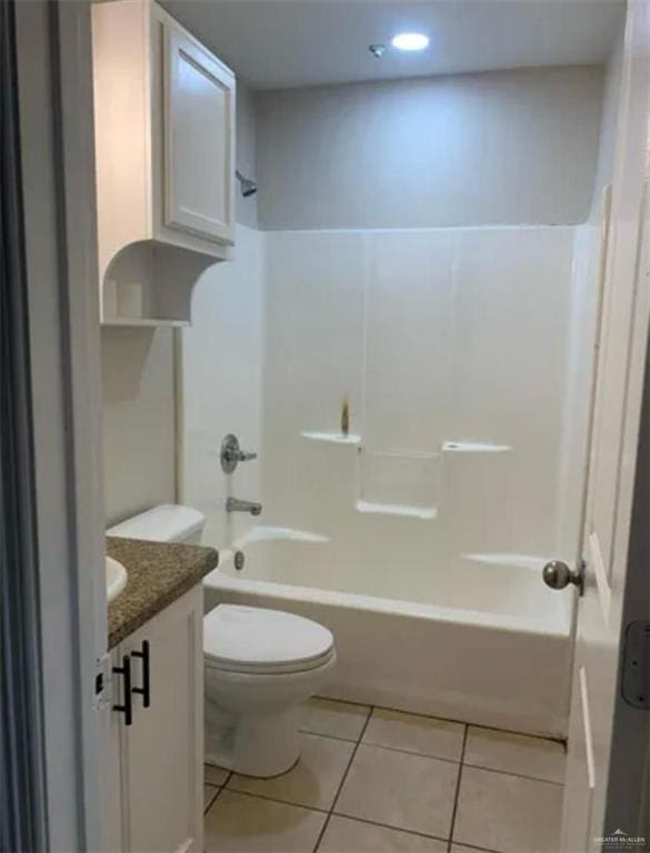 full bathroom featuring tile patterned floors, vanity, tub / shower combination, and toilet