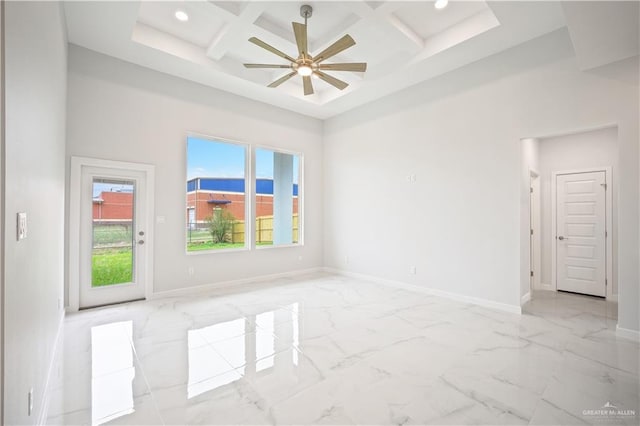 spare room featuring recessed lighting, a high ceiling, coffered ceiling, baseboards, and marble finish floor