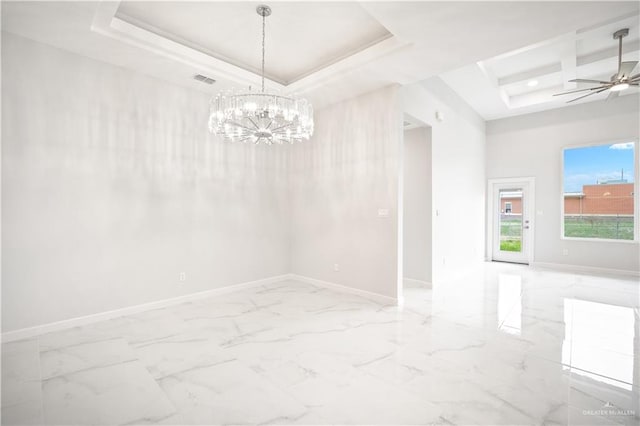 spare room featuring marble finish floor, baseboards, a tray ceiling, and ceiling fan