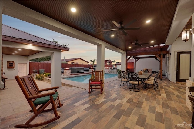 1320 S Cesar Chavez Rd, Edinburg, TX 78542 - fenced backyard with ceiling fan, a hot tub, a patio area, and outdoor dining area