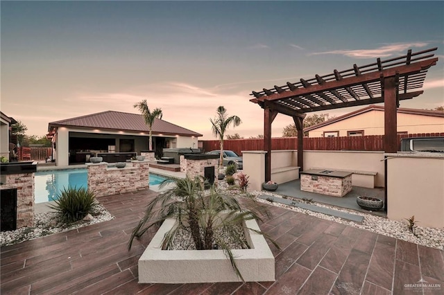1320 S Cesar Chavez Rd, Edinburg, TX 78542 - view of patio with exterior kitchen, exterior bar, an outdoor fire pit, and a pergola