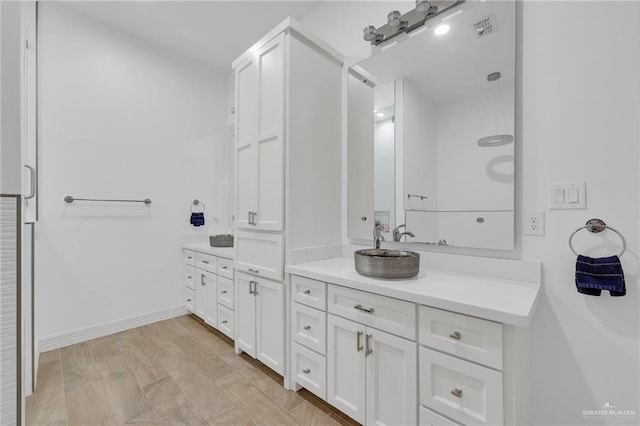 1320 S Cesar Chavez Rd, Edinburg, TX 78542 - bathroom with vanity and baseboards