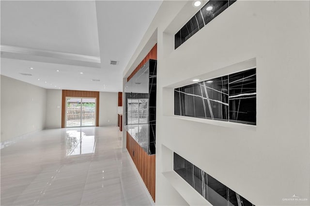 hallway featuring recessed lighting and visible vents