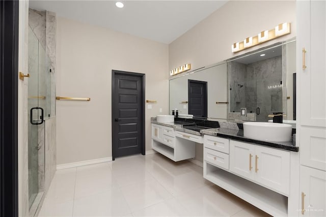 bathroom featuring an enclosed shower, vanity, and tile patterned floors