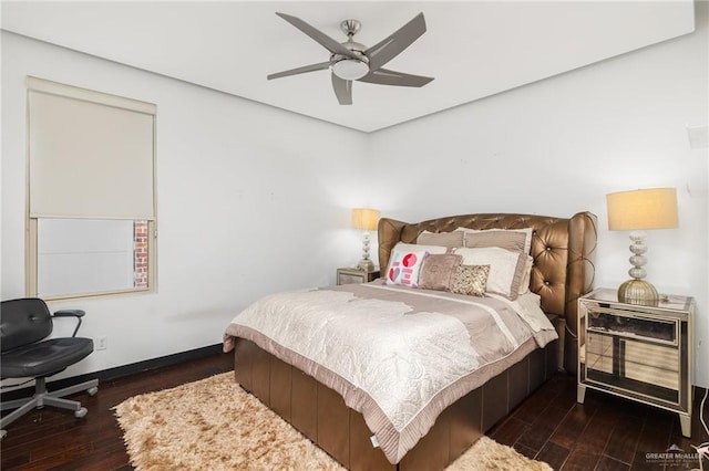 bedroom with dark hardwood / wood-style floors and ceiling fan