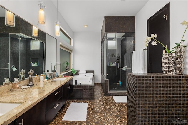 bathroom with tile patterned flooring, vanity, and separate shower and tub