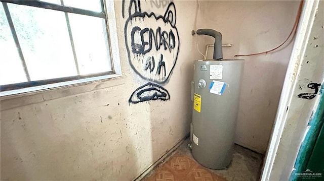 utility room featuring electric water heater