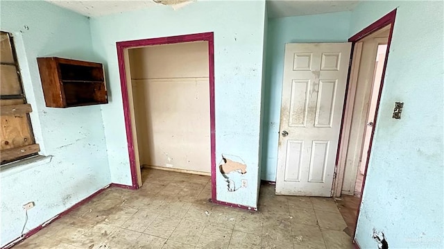 unfurnished bedroom featuring a closet