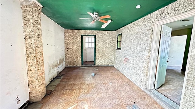 empty room featuring ceiling fan