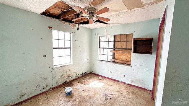 spare room featuring ceiling fan