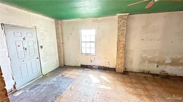 foyer featuring ceiling fan