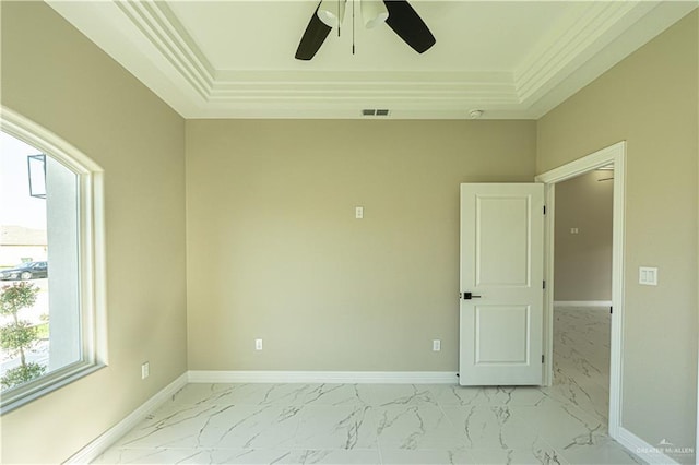 unfurnished room with marble finish floor, baseboards, and visible vents