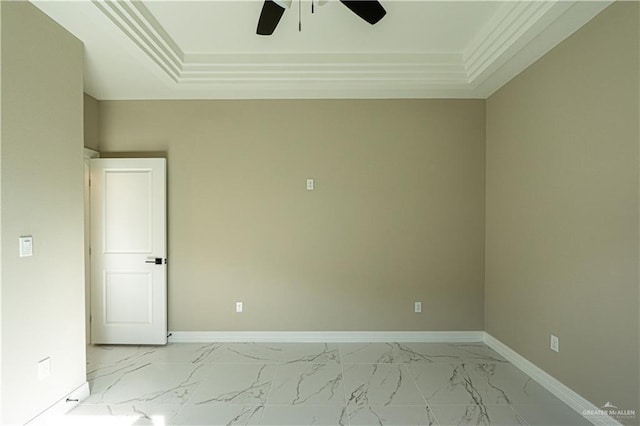 empty room featuring marble finish floor, baseboards, and a ceiling fan