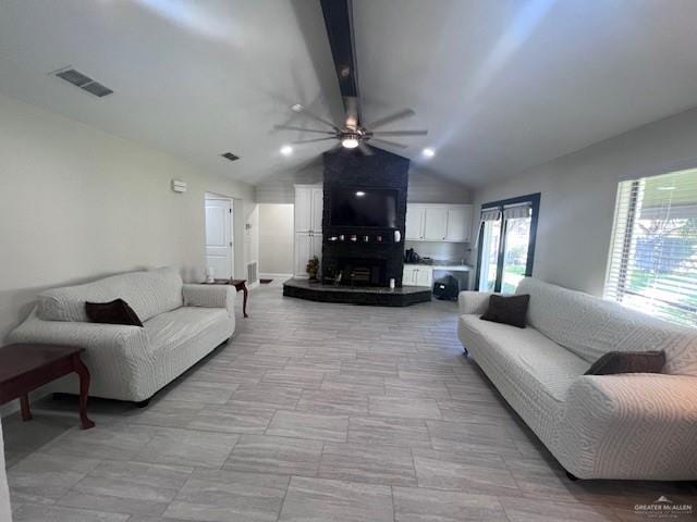 living room featuring ceiling fan and lofted ceiling with beams