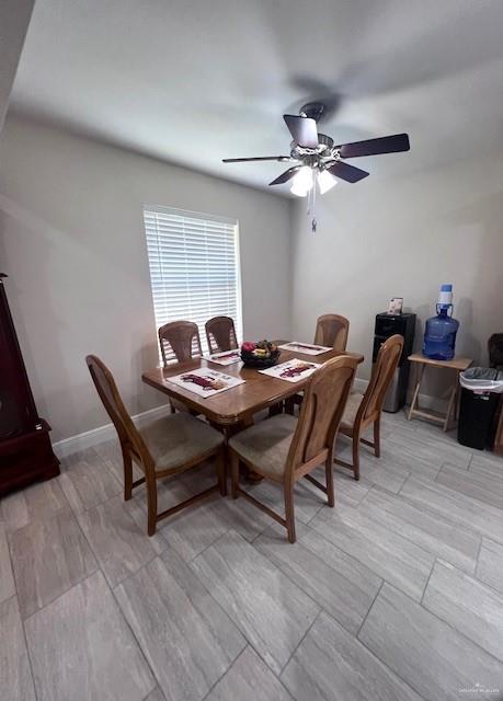 dining space with ceiling fan